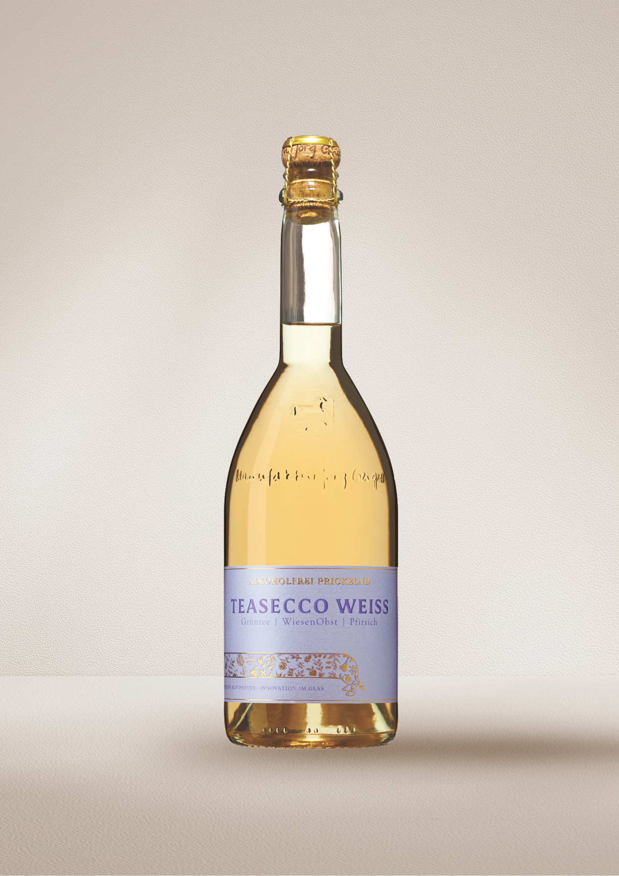 Bottle of "TEASECCO Weiss".  Dealcoholized wine on a beige background.